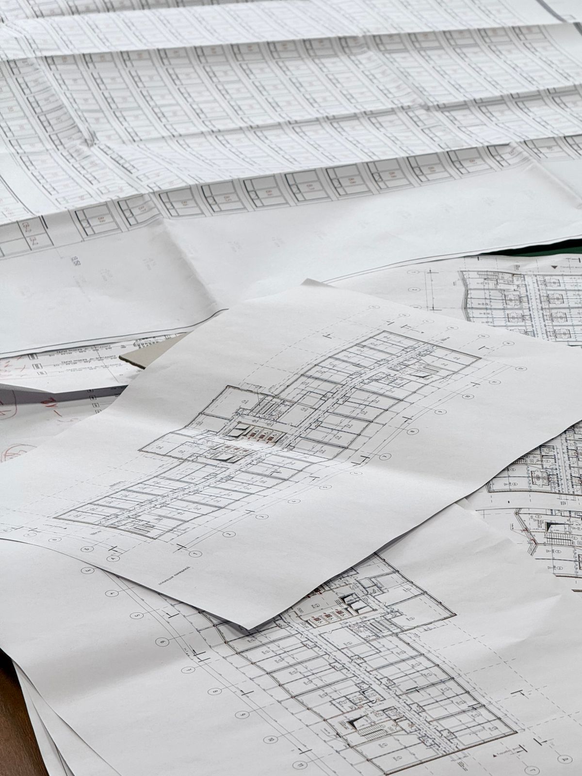 Construction drawings spread across a table